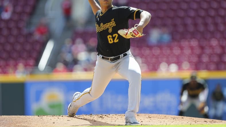 Sep 13, 2022; Cincinnati, Ohio, USA; Pittsburgh Pirates starting pitcher Johan Oviedo (62) pitches against the Cincinnati Reds in the first inning at Great American Ball Park. Mandatory Credit: Katie Stratman-USA TODAY Sports