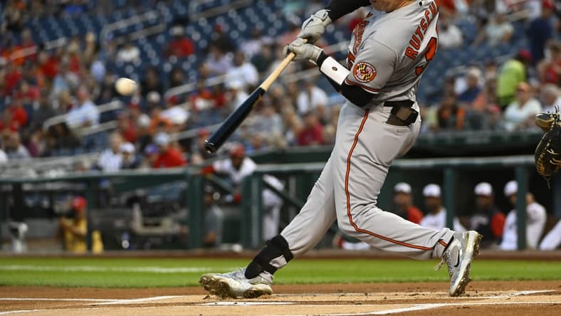 Sep 13, 2022; Washington, District of Columbia, USA; Baltimore Orioles catcher Adley Rutschman (35) hits a single against the Washington Nationals during the first inning at Nationals Park. Mandatory Credit: Brad Mills-USA TODAY Sports