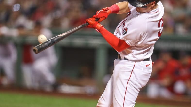 Sep 13, 2022; Boston, Massachusetts, USA; Boston Red Sox catcher Reese McGuire (3) hits a home run during the third inning against the New York Yankees at Fenway Park. Mandatory Credit: Paul Rutherford-USA TODAY Sports