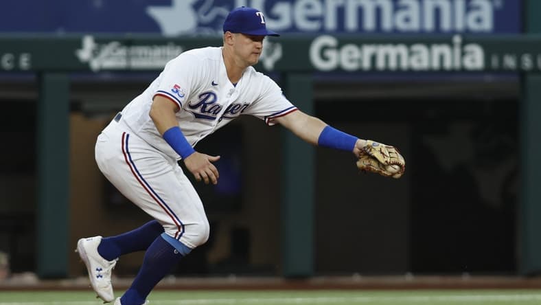 Sep 13, 2022; Arlington, Texas, USA; Texas Rangers third baseman Josh Jung (6) fields a ground ball in the first inning against the Oakland Athletics at Globe Life Field. Mandatory Credit: Tim Heitman-USA TODAY Sports