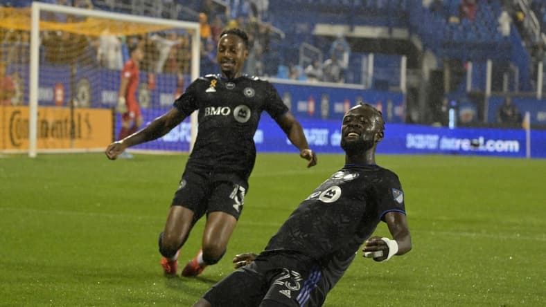 Sep 13, 2022; Montreal, Quebec, CAN; CF Montreal forward Kei Kamara (23) celebrates with teammate forward Mason Toye (13) after scoring a goal against Chicago Fire FC goalkeeper Gaga Slolina (1) during the first half at Stade Saputo. Mandatory Credit: Eric Bolte-USA TODAY Sports