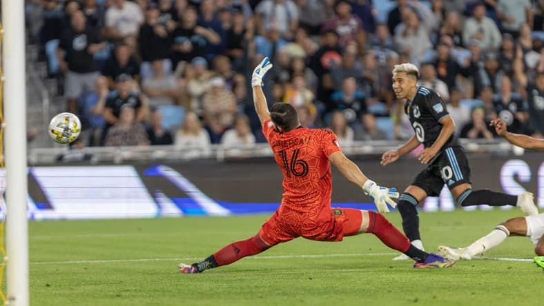 Sep 13, 2022; Saint Paul, Minnesota, USA; Los Angeles FC goalkeeper Maxime Crepeau (16) makes a save against Minnesota United midfielder Emanuel Reynoso (10) in the first half at Allianz Field. Mandatory Credit: Matt Blewett-USA TODAY Sports