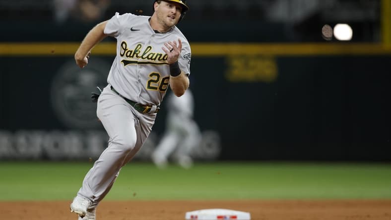 Sep 13, 2022; Arlington, Texas, USA; Oakland Athletics third baseman Sheldon Neuse (26) runs to third base in the fourth inning against the Texas Rangers at Globe Life Field. Mandatory Credit: Tim Heitman-USA TODAY Sports