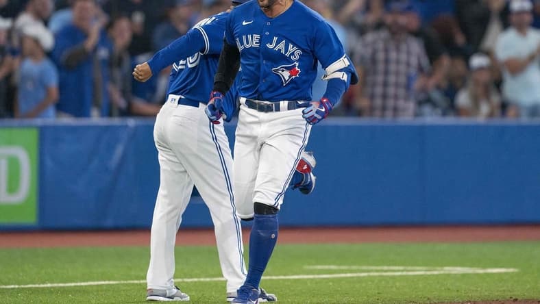 Sep 13, 2022; Toronto, Ontario, CAN; Toronto Blue Jays designated hitter George Springer (4) celebrates as he runs the bases after hitting a two run home run against the Tampa Bay Rays during the seventh inning at Rogers Centre. Mandatory Credit: Nick Turchiaro-USA TODAY Sports