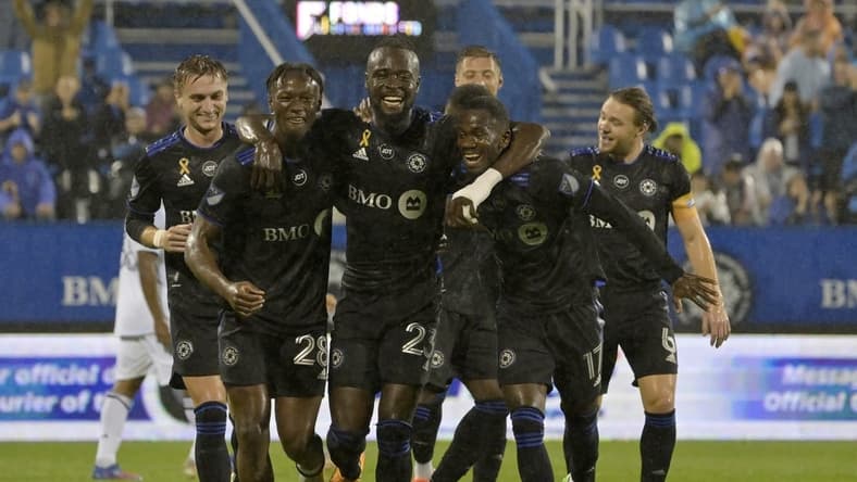 Sep 13, 2022; Montreal, Quebec, CAN; CF Montreal forward Kei Kamara (23) celebrates with teammates including midfielder Djordje Mihailovic (8) and midfielder Ismael Kone (28) and forward Jojea Kwizera (17) after scoring his second goal against the Chicago Fire FC during the first half at Stade Saputo. Mandatory Credit: Eric Bolte-USA TODAY Sports