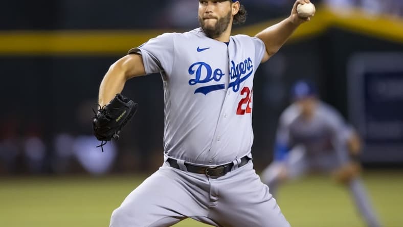 Sep 13, 2022; Phoenix, Arizona, USA; Los Angeles Dodgers pitcher Clayton Kershaw (22) throws in the first inning against the Arizona Diamondbacks at Chase Field. Mandatory Credit: Mark J. Rebilas-USA TODAY Sports