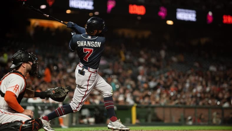Sep 13, 2022; San Francisco, California, USA; Atlanta Braves shortstop Dansby Swanson (7) hits a two run home run during the third inning against the San Francisco Giants at Oracle Park. Mandatory Credit: Ed Szczepanski-USA TODAY Sports