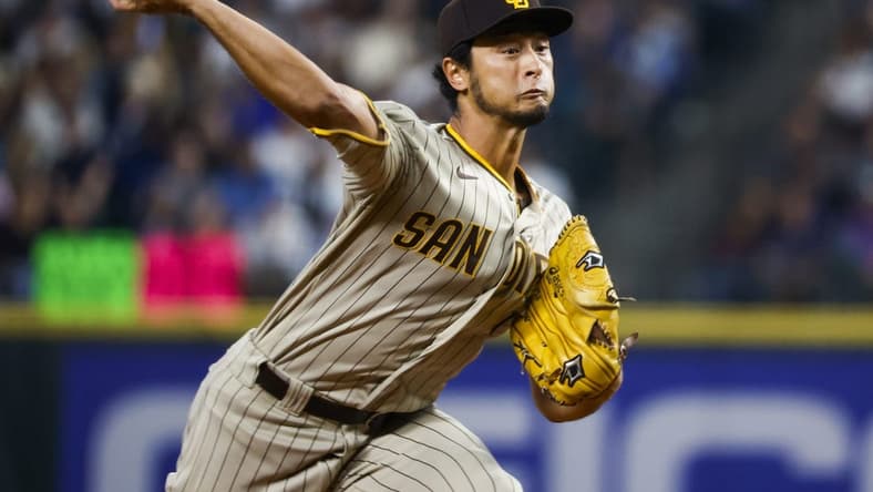 Sep 13, 2022; Seattle, Washington, USA; San Diego Padres starting pitcher Yu Darvish (11) throws against the Seattle Mariners during the third inning at T-Mobile Park. Mandatory Credit: Joe Nicholson-USA TODAY Sports