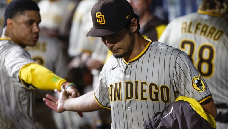 Sep 13, 2022; Seattle, Washington, USA; San Diego Padres starting pitcher Yu Darvish (right) high fives right fielder Juan Soto (22) following the eighth inning against the Seattle Mariners at T-Mobile Park. Mandatory Credit: Joe Nicholson-USA TODAY Sports