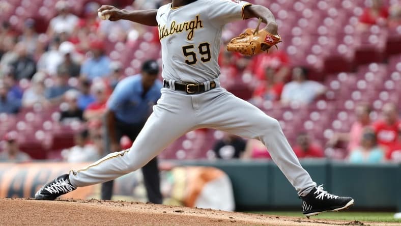 Sep 14, 2022; Cincinnati, Ohio, USA; Pittsburgh Pirates starting pitcher Roansy Contreras (59) throws a pitch against the Cincinnati Reds during the first inning at Great American Ball Park. Mandatory Credit: David Kohl-USA TODAY Sports