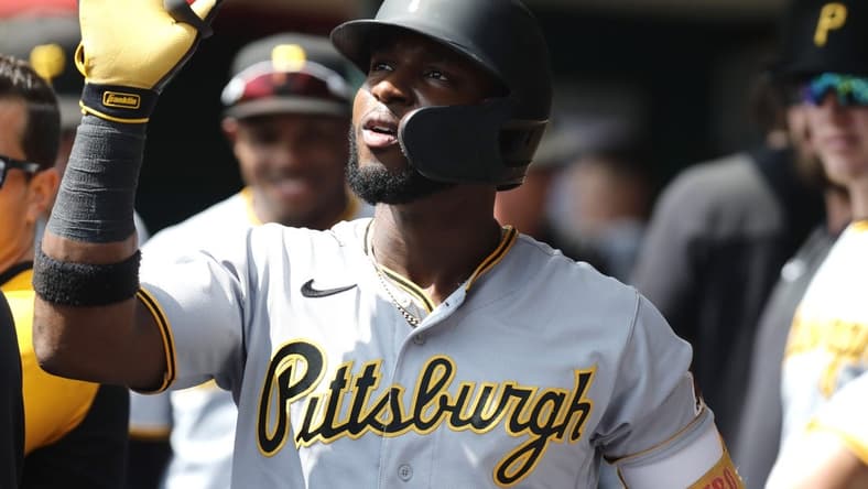 Sep 14, 2022; Cincinnati, Ohio, USA; Pittsburgh Pirates shortstop Rodolfo Castro (14) celebrates in the dugout after hitting a three-run home run against the Cincinnati Reds during the third inning at Great American Ball Park. Mandatory Credit: David Kohl-USA TODAY Sports