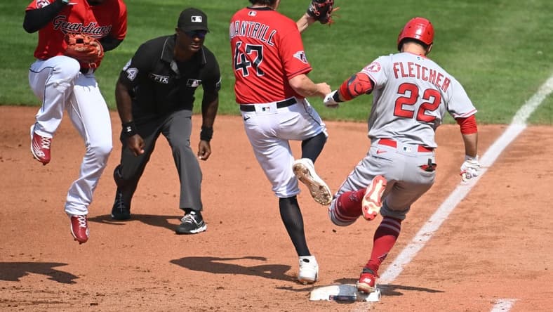 Sep 14, 2022; Cleveland, Ohio, USA; Cleveland Guardians starting pitcher Cal Quantrill (47) forces out Los Angeles Angels shortstop David Fletcher (22) as Guardians second baseman Andres Gimenez, left, tries to stay out of the way during the fifth inning at Progressive Field. Mandatory Credit: Ken Blaze-USA TODAY Sports