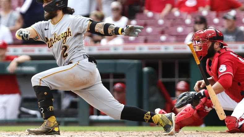 Sep 14, 2022; Cincinnati, Ohio, USA; Pittsburgh Pirates first baseman Michael Chavis (2) hits a two-run single against the Cincinnati Reds during the ninth inning at Great American Ball Park. Mandatory Credit: David Kohl-USA TODAY Sports