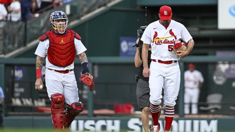 Sep 14, 2022; St. Louis, Missouri, USA; St. Louis Cardinals catcher Yadier Molina (4) and starting pitcher Adam Wainwright (50) walk in from the bullpen before their 325th start as a battery breaking the MLB record before a game against the Milwaukee Brewers at Busch Stadium. Mandatory Credit: Jeff Curry-USA TODAY Sports