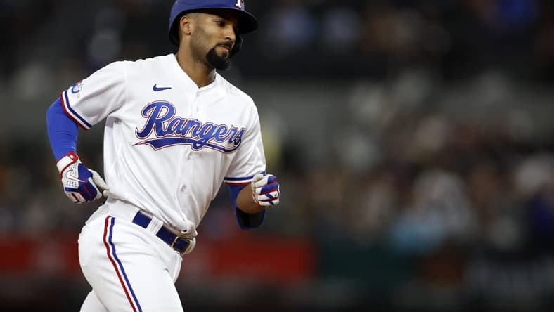 Sep 14, 2022; Arlington, Texas, USA; Texas Rangers second baseman Marcus Semien (2) rounds the bases after hitting a three-run home run against the Oakland Athletics in the second inning at Globe Life Field. Mandatory Credit: Tim Heitman-USA TODAY Sports