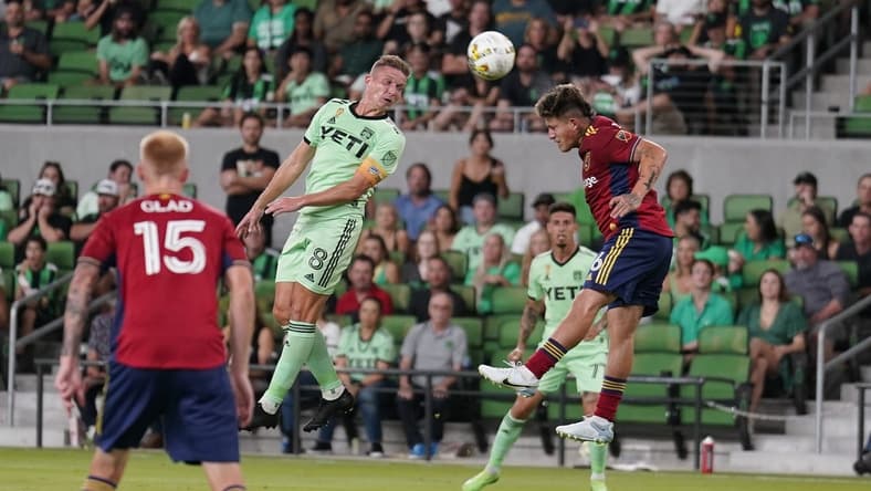 Sep 14, 2022; Austin, Texas, USA; Austin FC midfielder Alexander Ring (8) and Real Salt Lake midfielder Diego Luna (26) battle for the ball during the first half at Q2 Stadium. Mandatory Credit: Scott Wachter-USA TODAY Sports