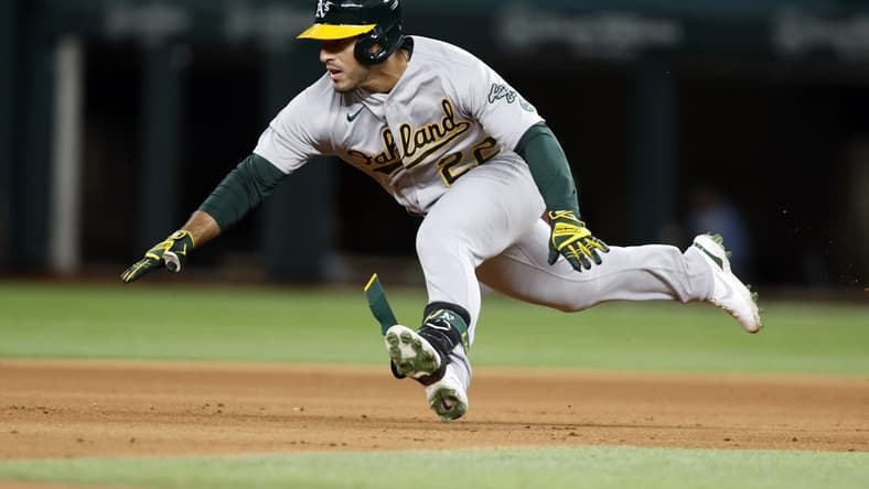 Sep 14, 2022; Arlington, Texas, USA; Oakland Athletics center fielder Ramon Laureano (22) dives into second base with a double in the fifth inning against the Texas Rangers at Globe Life Field. Mandatory Credit: Tim Heitman-USA TODAY Sports