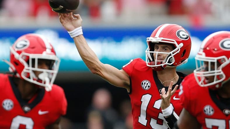 Georgia quarterback Stetson Bennett (13) throws a touchdown during the first half of a college football game between Samford and Georgia in Athens, Ga., on Saturday, Sept. 10, 2022.

Syndication Online Athens