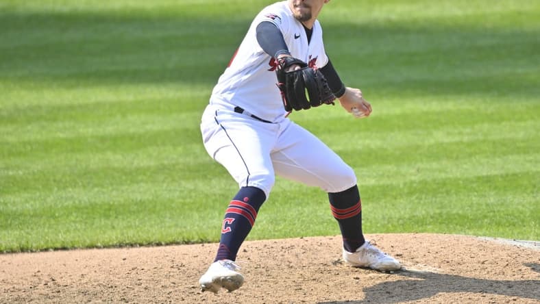 Sep 15, 2022; Cleveland, Ohio, USA; Cleveland Guardians relief pitcher Kirk McCarty (59) delivers a pitch in the ninth inning against the Chicago White Sox at Progressive Field. Mandatory Credit: David Richard-USA TODAY Sports