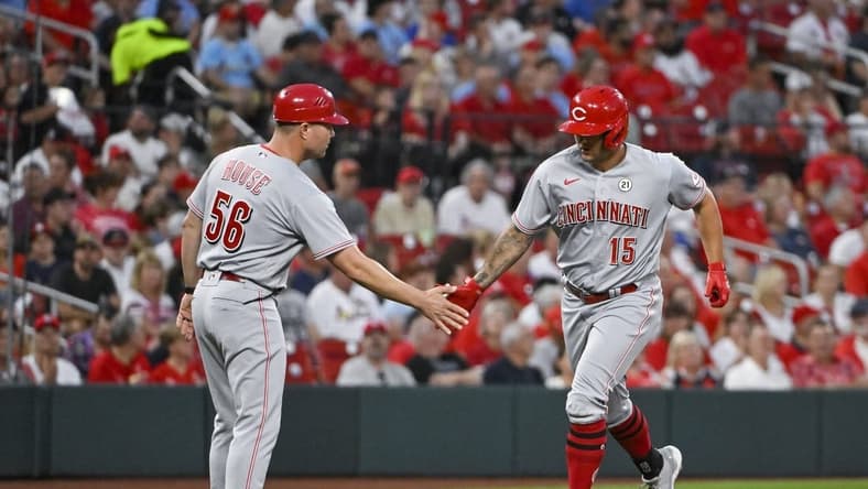 Sep 15, 2022; St. Louis, Missouri, USA; Cincinnati Reds center fielder Nick Senzel (15) is congratulated by third base J.R. House (56) after hitting a solo home run against the St. Louis Cardinals during the second inning at Busch Stadium. Mandatory Credit: Jeff Curry-USA TODAY Sports