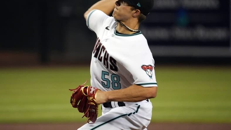 Sep 15, 2022; Phoenix, Arizona, USA; Arizona Diamondbacks starting pitcher Drey Jameson (58) pitches against the San Diego Padres during the first inning of his first career MLB start at Chase Field. Mandatory Credit: Joe Camporeale-USA TODAY Sports