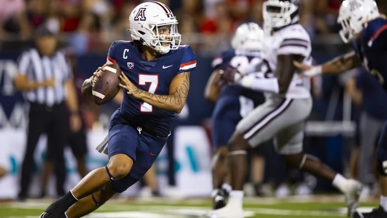 Sep 10, 2022; Tucson, Arizona, USA; Arizona Wildcats quarterback Jayden de Laura (7) against the Mississippi State Bulldogs at Arizona Stadium. Mandatory Credit: Mark J. Rebilas-USA TODAY Sports