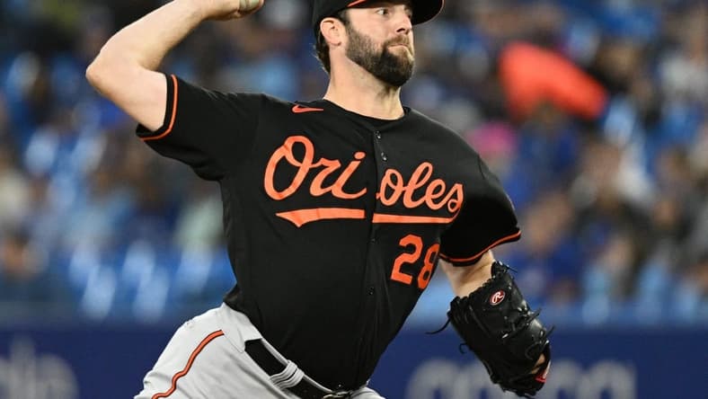 Sep 16, 2022; Toronto, Ontario, CAN;  Baltimore Orioles starting pitcher Jordan Lyles (28) delivers a pitch against the Toronto Blue Jays in the first inning at Rogers Centre. Mandatory Credit: Dan Hamilton-USA TODAY Sports