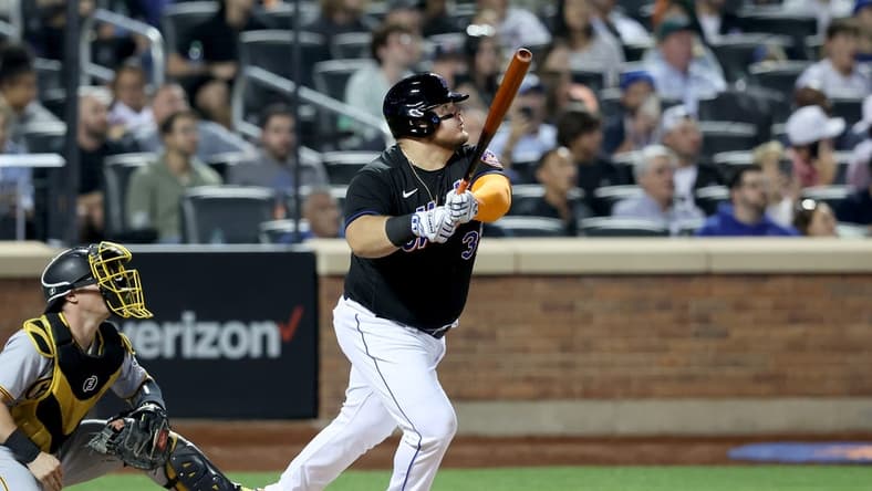 Sep 16, 2022; New York City, New York, USA; New York Mets designated hitter Daniel Vogelbach (32) follows through on a solo home run against the Pittsburgh Pirates during the fourth inning at Citi Field. Mandatory Credit: Brad Penner-USA TODAY Sports