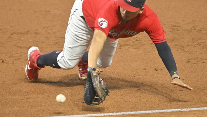 Sep 16, 2022; Cleveland, Ohio, USA; Cleveland Guardians first baseman Josh Naylor (22) dives for a ground ball in the third inning against the Minnesota Twins at Progressive Field. Mandatory Credit: David Richard-USA TODAY Sports