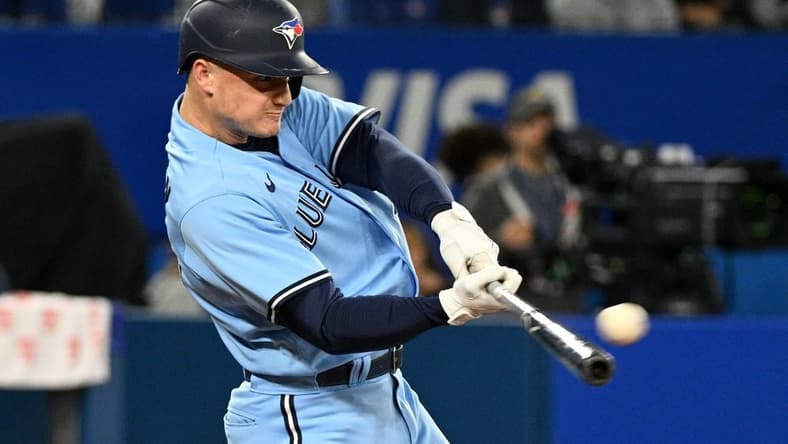 Sep 16, 2022; Toronto, Ontario, CAN; Toronto Blue Jays third baseman Matt Chapman (26) hits a single against the Baltimore Orioles in the fifth inning at Rogers Centre. Mandatory Credit: Dan Hamilton-USA TODAY Sports