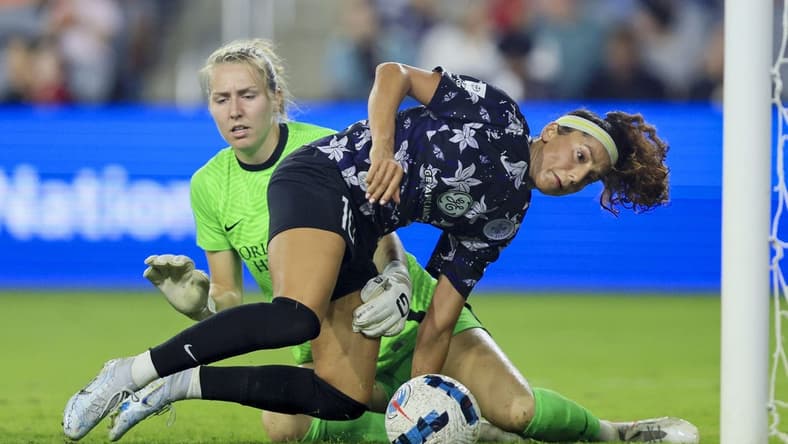 Sep 16, 2022; Louisville, Kentucky, USA; Racing Louisville FC forward Nadia Nadim (10) battles for the ball against Orlando Pride goalkeeper Anna Moorhouse (21) in the second half at Lynn Family Stadium. Mandatory Credit: Aaron Doster-USA TODAY Sports