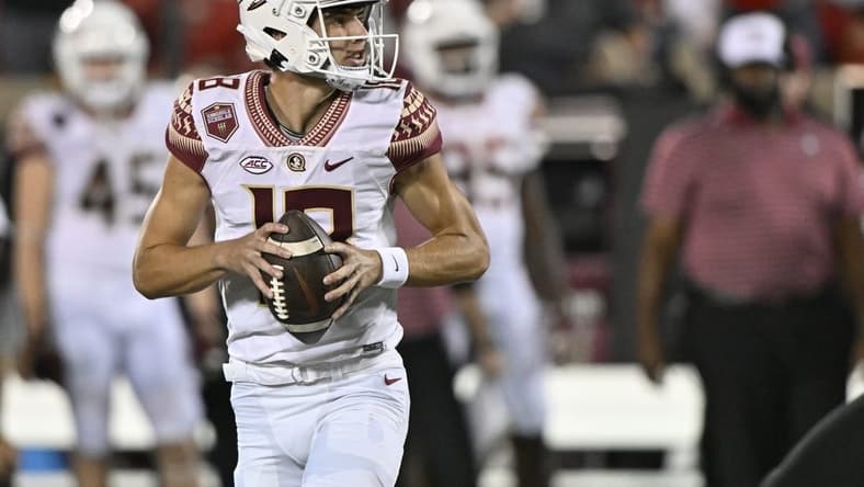 Sep 16, 2022; Louisville, Kentucky, USA; Florida State Seminoles quarterback Tate Rodemaker (18) looks to pass against the Louisville Cardinals during the second quarter at Cardinal Stadium. Mandatory Credit: Jamie Rhodes-USA TODAY Sports
