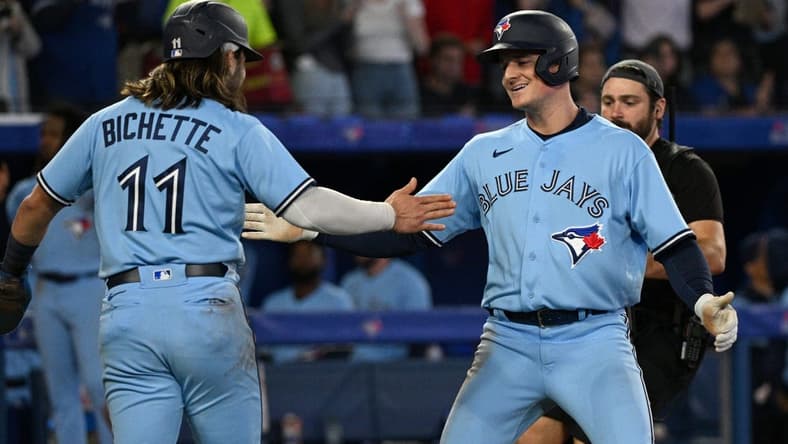 Sep 16, 2022; Toronto, Ontario, CAN; Toronto Blue Jays third baseman Matt Chapman (26) is greeted by shortstop Bo Bichette (11) after hitting a two run home run against the Baltimore Orioles in the sixth inning at Rogers Centre. Mandatory Credit: Dan Hamilton-USA TODAY Sports