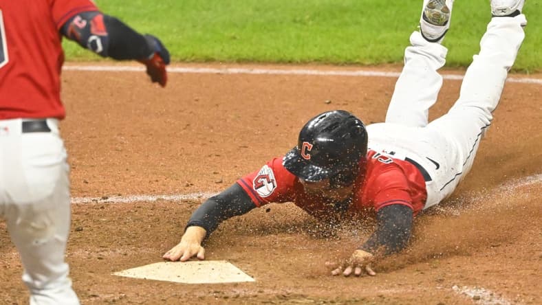 Sep 16, 2022; Cleveland, Ohio, USA; Cleveland Guardians pinch runner Ernie Clement (28) scores from second base on a wild pitch in the eighth inning against the Minnesota Twins at Progressive Field. Mandatory Credit: David Richard-USA TODAY Sports