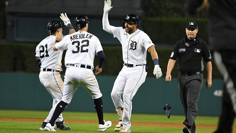 Sep 16, 2022; Detroit, Michigan, USA; Detroit Tigers right fielder Victor Reyes (22) celebrates with shortstop Javier Baez (28) and third baseman Ryan Kreidler (32) after hitting a sacrifice fly to score the game-winning run against the Chicago White Sox in the tenth inning at Comerica Park. Mandatory Credit: Lon Horwedel-USA TODAY Sports