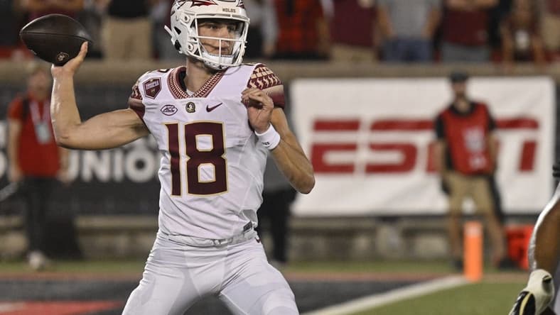 Sep 16, 2022; Louisville, Kentucky, USA;  Florida State Seminoles quarterback Tate Rodemaker (18) throws against the Louisville Cardinals during the second half at Cardinal Stadium. Florida State defeated Louisville 35-31. Mandatory Credit: Jamie Rhodes-USA TODAY Sports