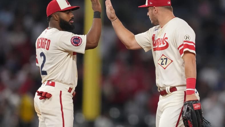 Sep 16, 2022; Anaheim, California, USA; Los Angeles Angels center fielder Mike Trout (27) and second baseman Luis Rengifo (2) celebrate at the end of the game against the Seattle Mariners at Angel Stadium. Mandatory Credit: Kirby Lee-USA TODAY Sports