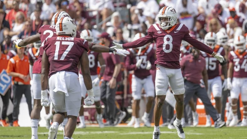 Sep 17, 2022; Blacksburg, Virginia, USA; Virginia Tech Hokies defender Brion Murray ( 8 ) celebrates with teammates after forcing the Wofford Terriers offense to punt in the second quarter at Lane Stadium. Mandatory Credit: Lee Luther Jr.-USA TODAY Sports