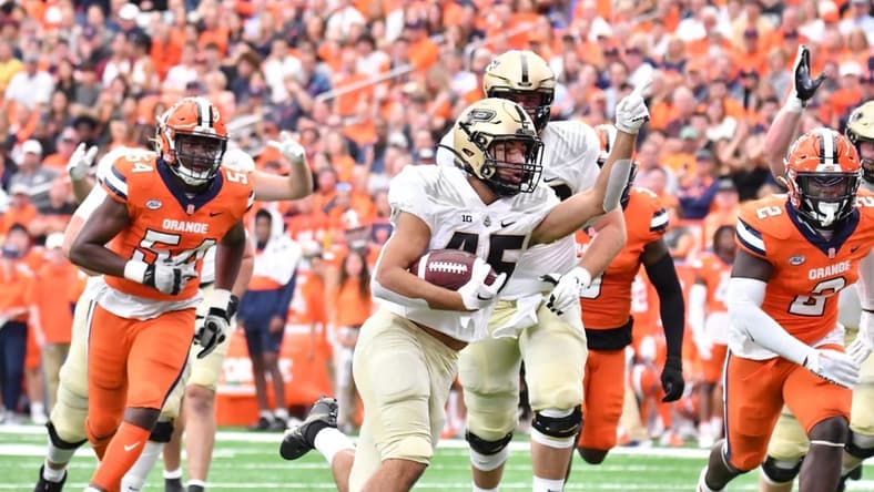 Sep 17, 2022; Syracuse, New York, USA; Purdue Boilermakers running back Devin Mockobee (45) runs for a touchdown against the Syracuse Orange in the first quarter at JMA Wireless Dome. Mandatory Credit: Mark Konezny-USA TODAY Sports