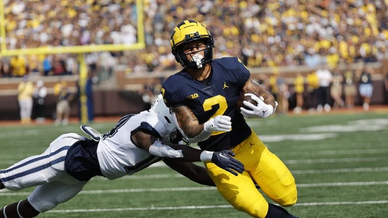 Sep 17, 2022; Ann Arbor, Michigan, USA;  Michigan Wolverines running back Blake Corum (2) rushes in the first half against the Connecticut Huskies at Michigan Stadium. Mandatory Credit: Rick Osentoski-USA TODAY Sports