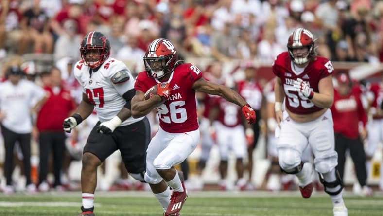 Sep 17, 2022; Bloomington, Indiana, USA;  Indiana Hoosiers running back Josh Henderson (26) runs the ball during the second quarter against the Western Kentucky Hilltoppers at Memorial Stadium. Mandatory Credit: Marc Lebryk-USA TODAY Sports