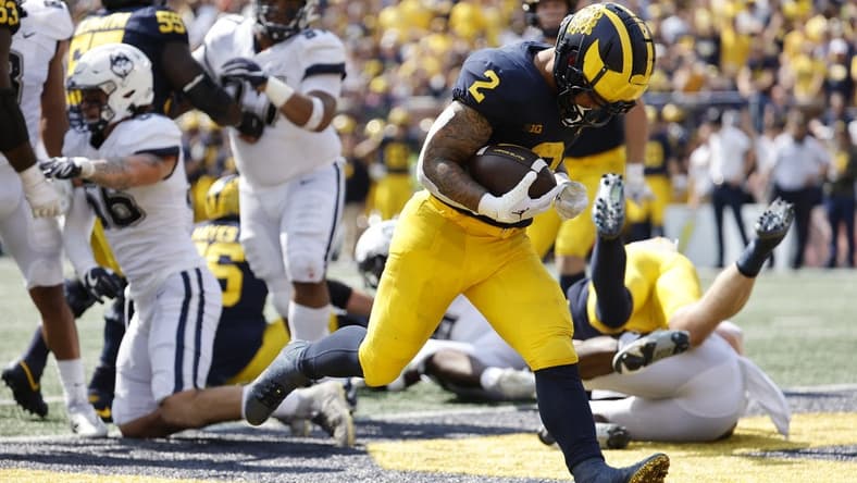 Sep 17, 2022; Ann Arbor, Michigan, USA;  Michigan Wolverines running back Blake Corum (2) rushes for a touchdown in the first half against the Connecticut Huskies at Michigan Stadium. Mandatory Credit: Rick Osentoski-USA TODAY Sports