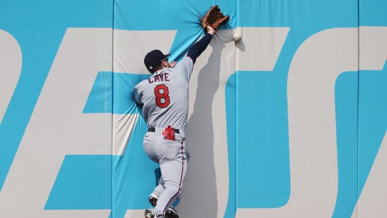 Sep 17, 2022; Cleveland, Ohio, USA; Minnesota Twins left fielder Jake Cave (8) misses a ball hit by Cleveland Guardians second baseman Andres Gimenez (not pictured) during the fourth inning at Progressive Field. Mandatory Credit: Ken Blaze-USA TODAY Sports