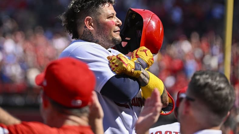 Sep 17, 2022; St. Louis, Missouri, USA; St. Louis Cardinals catcher Yadier Molina (4) salutes the fans as he receives a standing ovation after hitting a two run home run against the Cincinnati Reds during the third inning at Busch Stadium. Mandatory Credit: Jeff Curry-USA TODAY Sports