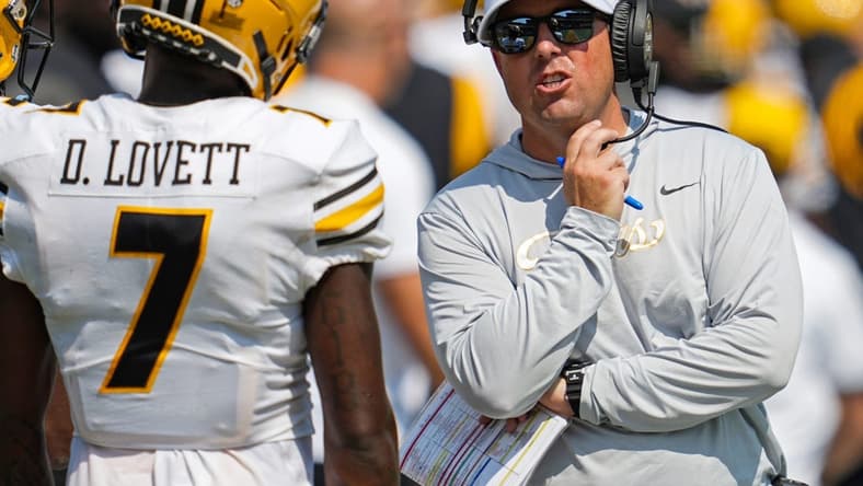 Sep 17, 2022; Columbia, Missouri, USA; Missouri Tigers head coach Eliah Drinkwitz talks with wide receiver Dominic Lovett (7) during the second half against the Abilene Christian Wildcats at Faurot Field at Memorial Stadium. Mandatory Credit: Jay Biggerstaff-USA TODAY Sports