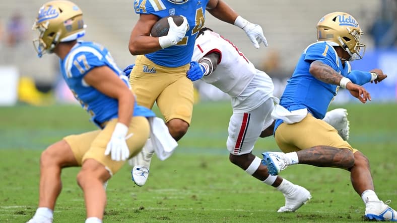 Sep 17, 2022; Pasadena, California, USA; UCLA Bruins running back Zach Charbonnet (24) carries the ball for a first down in the first half against the South Alabama Jaguars at the Rose Bowl. Mandatory Credit: Jayne Kamin-Oncea-USA TODAY Sports