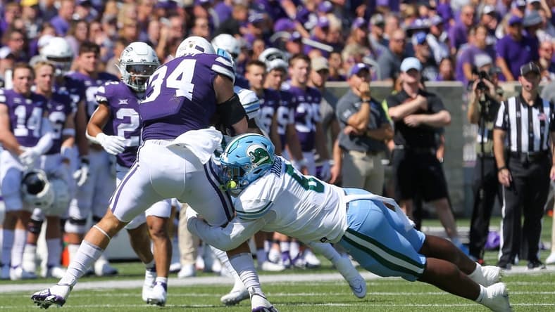 Sep 17, 2022; Manhattan, Kansas, USA; Kansas State Wildcats tight end Ben Sinnott (34) is tackled by Tulane Green Wave linebacker Darius Hodges (6) during the first quarter at Bill Snyder Family Football Stadium. Mandatory Credit: Scott Sewell-USA TODAY Sports