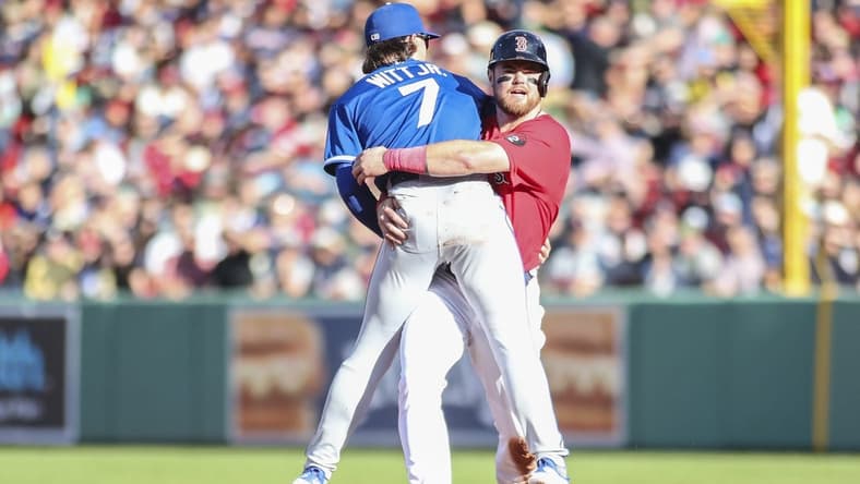 Sep 17, 2022; Boston, Massachusetts, USA;  Boston Red Sox second baseman Christian Arroyo (39) collides with Kansas City Royals shortstop Bobby Witt Jr. (7) during a double play in the second inning at Fenway Park. Mandatory Credit: Wendell Cruz-USA TODAY Sports