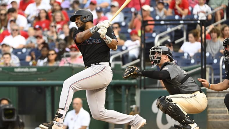 Sep 17, 2022; Washington, District of Columbia, USA; Miami Marlins left fielder Jerar Encarnacion (64) hits a two run home run against the Washington Nationals during the fourth inning at Nationals Park. Mandatory Credit: Brad Mills-USA TODAY Sports