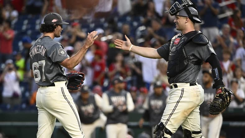 Sep 17, 2022; Washington, District of Columbia, USA; Washington Nationals relief pitcher Kyle Finnegan (67) is congratulated by catcher Riley Adams (15) after earning a save against the Miami Marlins at Nationals Park. Mandatory Credit: Brad Mills-USA TODAY Sports